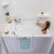 Ella Capri 30"x52" Acrylic Hydro Massage Walk-In Bathtub with Left Swing Door, 2 Piece Fast Fill Faucet, 2" Dual Drain, 2 overflows, two 5 ft. incoming supply lines and 2 drain elbows, 2 stainless steel grab bars in a white background.